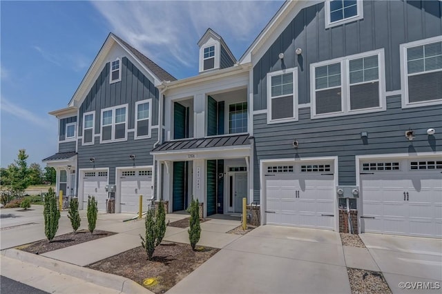 12106 Oxford Landing Dr Unit 202, Glen Allen, VA 23059 - townhome / multi-family property with board and batten siding, metal roof, and a garage
