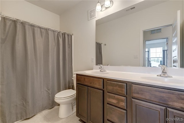 12106 Oxford Landing Dr Unit 202, Glen Allen, VA 23059 - bathroom with double vanity, toilet, tile patterned flooring, and a shower with shower curtain