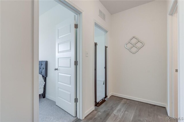 12106 Oxford Landing Dr Unit 202, Glen Allen, VA 23059 - hallway featuring wood finished floors and baseboards