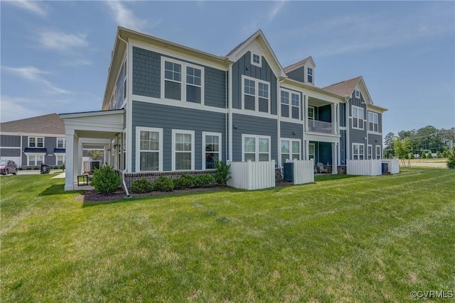 12106 Oxford Landing Dr Unit 202, Glen Allen, VA 23059 - back of property with board and batten siding and a yard