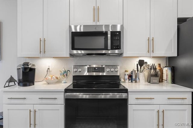 5234 Old Main St Unit C, Henrico, VA 23231 - kitchen with stainless steel appliances, decorative backsplash, light countertops, and white cabinets