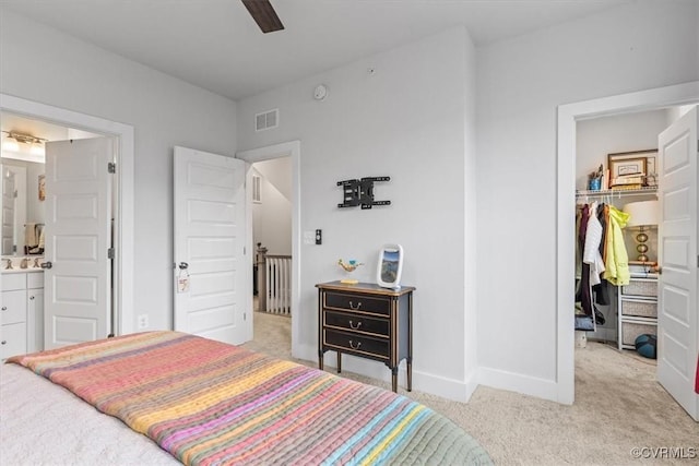 5234 Old Main St Unit C, Henrico, VA 23231 - bedroom featuring light carpet, a walk in closet, baseboards, ensuite bathroom, and a closet