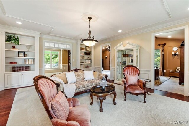 6306 Thistledew Mews, Moseley, VA 23120 - living room with built in shelves, dark wood-style floors, ornamental molding, recessed lighting, and wainscoting