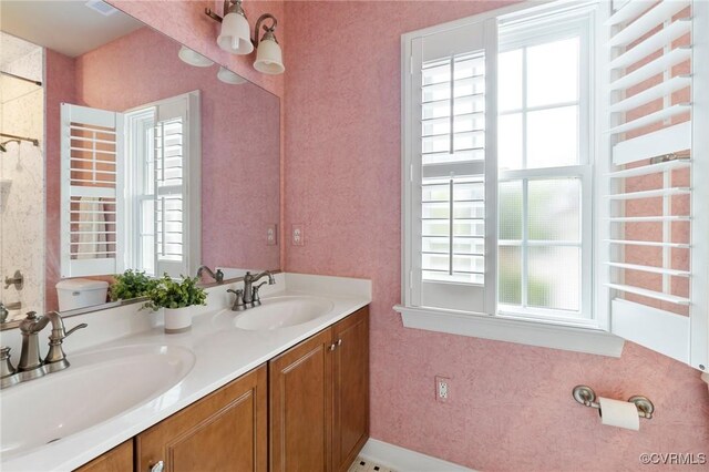 6306 Thistledew Mews, Moseley, VA 23120 - bathroom with plenty of natural light, double vanity, and toilet