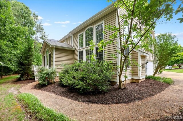 6306 Thistledew Mews, Moseley, VA 23120 - view of home's exterior with a garage and driveway