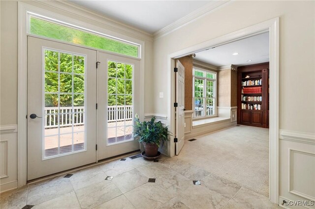 6306 Thistledew Mews, Moseley, VA 23120 - entryway with crown molding, a decorative wall, and wainscoting