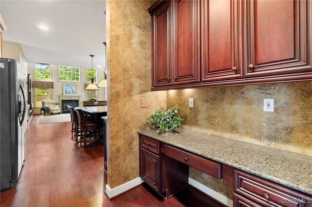 6306 Thistledew Mews, Moseley, VA 23120 - kitchen with refrigerator with ice dispenser, reddish brown cabinets, and dark wood finished floors