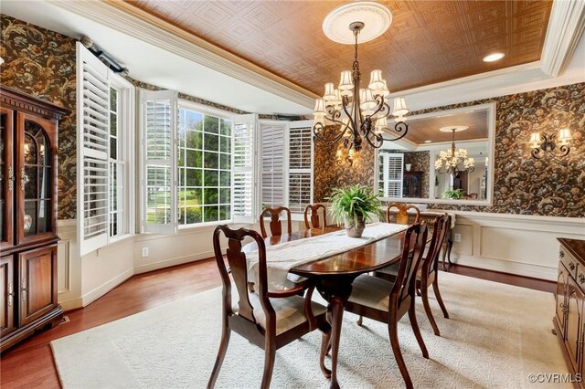 6306 Thistledew Mews, Moseley, VA 23120 - dining room with ornamental molding, a chandelier, light wood-type flooring, a wainscoted wall, and baseboards