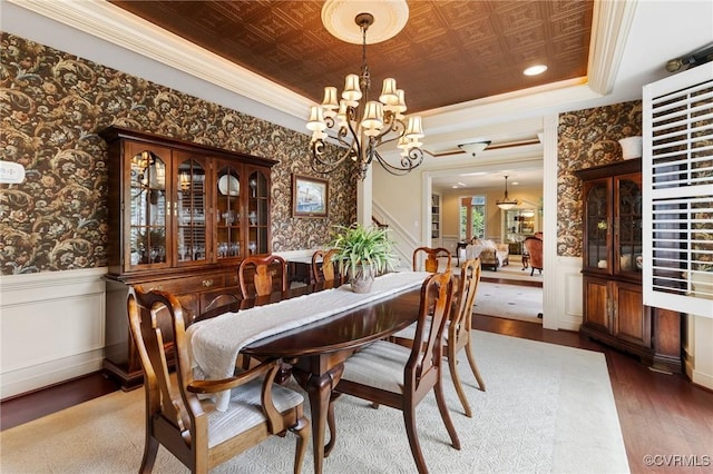 6306 Thistledew Mews, Moseley, VA 23120 - dining space with wood finished floors, a chandelier, a wainscoted wall, ornamental molding, and wallpapered walls