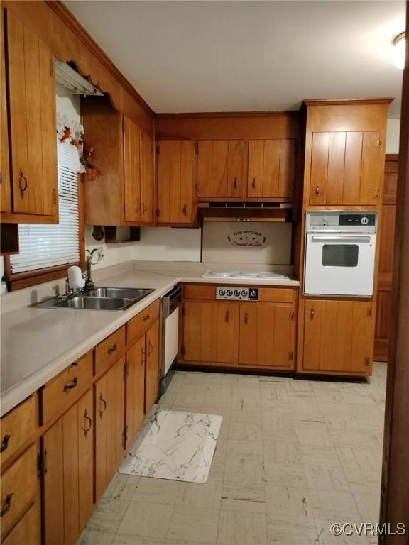 724 Milton Dr, Hampton, VA 23666 - kitchen featuring white appliances, a sink, light flooring, and light countertops