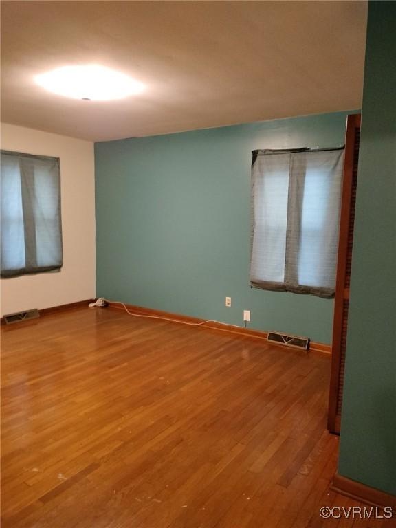 724 Milton Dr, Hampton, VA 23666 - unfurnished room with wood finished floors and baseboards