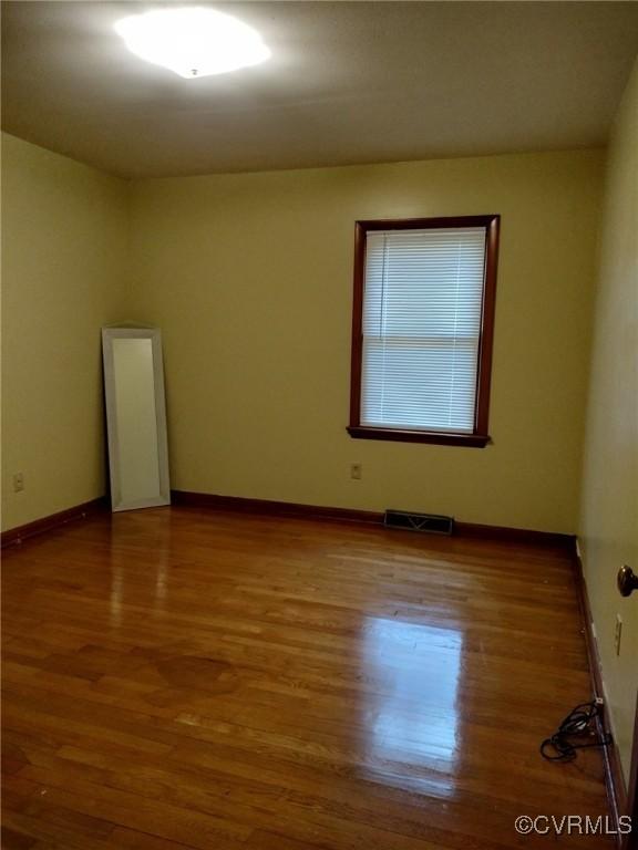 724 Milton Dr, Hampton, VA 23666 - empty room featuring wood finished floors and baseboards