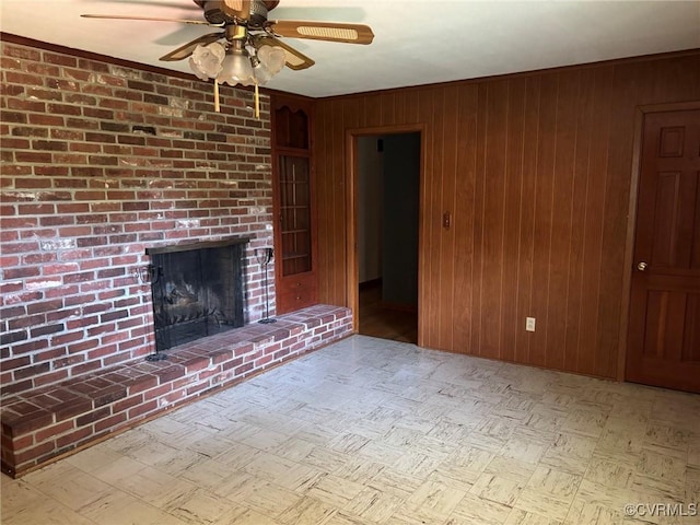 724 Milton Dr, Hampton, VA 23666 - unfurnished living room featuring a ceiling fan, wooden walls, and a fireplace