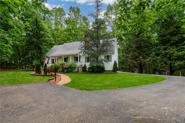 9865 Knobs Hill Ln, Amelia, VA 23002 - view of front facade featuring covered porch, a front lawn, asphalt driveway, and a chimney