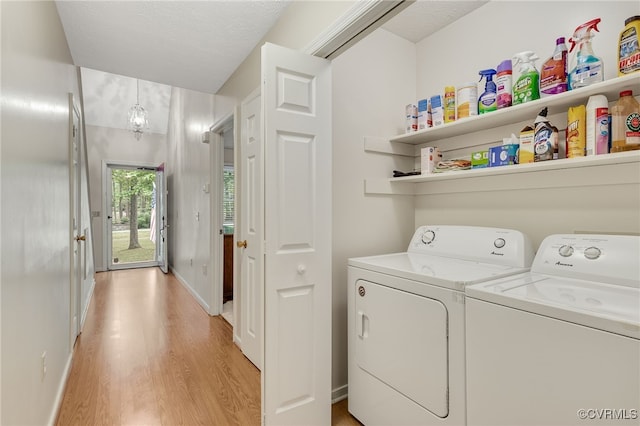 9865 Knobs Hill Ln, Amelia, VA 23002 - laundry area with light wood-style floors and washer and clothes dryer