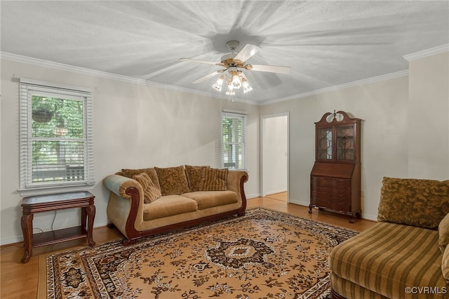 9865 Knobs Hill Ln, Amelia, VA 23002 - living area with wood finished floors, ceiling fan, and crown molding