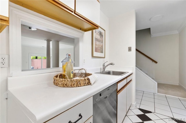 kitchen with dishwasher, a sink, light countertops, white cabinets, and crown molding