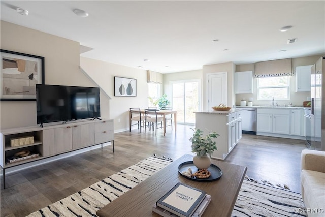 2124 Grand Reserve Way Unit N-1, Henrico, VA 23223 - living room featuring light wood-style flooring and baseboards