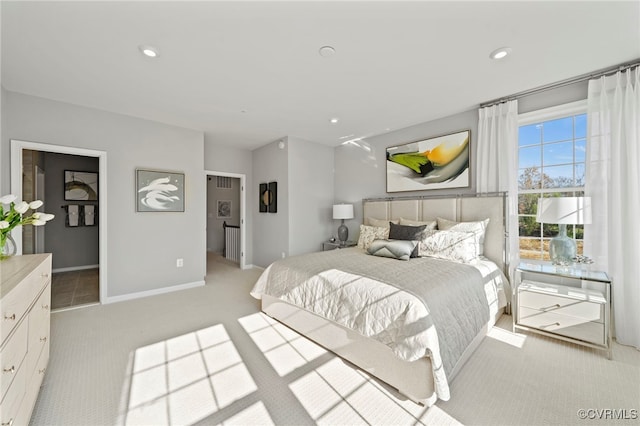bedroom featuring light colored carpet, baseboards, and recessed lighting