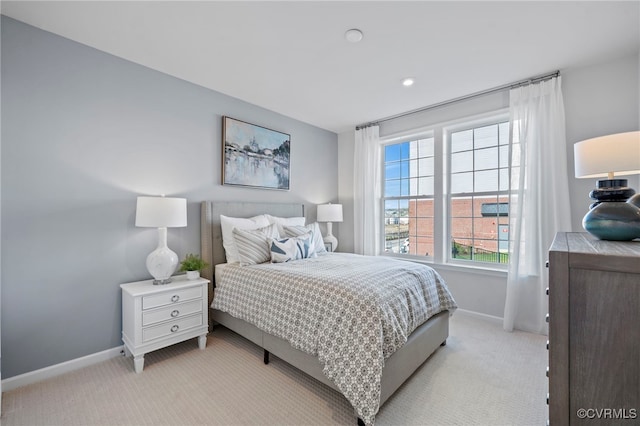 bedroom with light colored carpet, baseboards, and recessed lighting