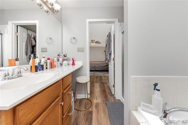 10913 Oak Arbor Ter, Chesterfield, VA 23831 - ensuite bathroom featuring wood finished floors, vanity, and a tub