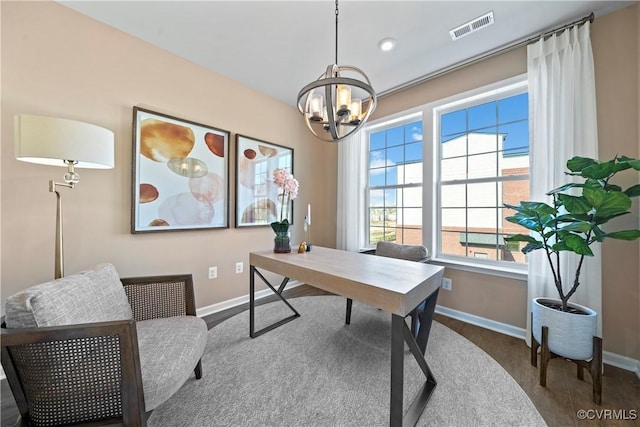 office featuring baseboards, a chandelier, wood finished floors, and recessed lighting