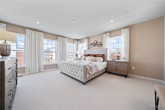 bedroom with baseboards, light carpet, and recessed lighting