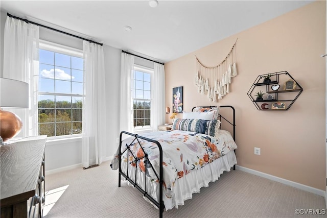 carpeted bedroom with baseboards