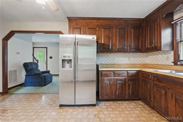 4501 Roxbury Rd, Charles City, VA 23030 - kitchen featuring stainless steel fridge with ice dispenser, light countertops, dark brown cabinetry, and ceiling fan