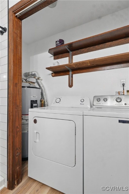 4501 Roxbury Rd, Charles City, VA 23030 - laundry area with washer and clothes dryer, light wood finished floors, and electric water heater