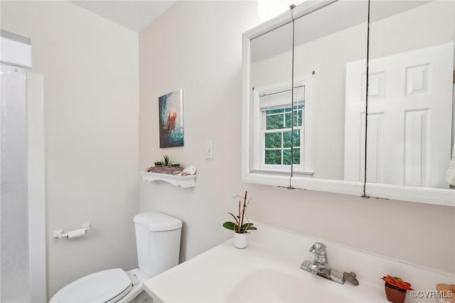 bathroom with toilet and vanity