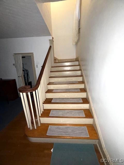 111 Jefferson St, Emporia, VA 23847 - stairway featuring wood finished floors