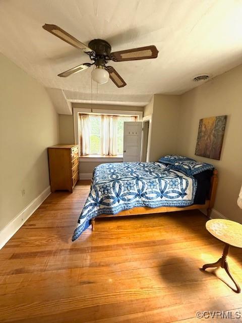 111 Jefferson St, Emporia, VA 23847 - bedroom featuring light wood-style floors, baseboards, and a ceiling fan