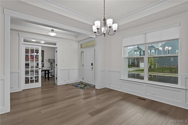 9975 Honeybee Dr, Mechanicsville, VA 23116 - entryway featuring a chandelier, wood finished floors, a wainscoted wall, crown molding, and a decorative wall