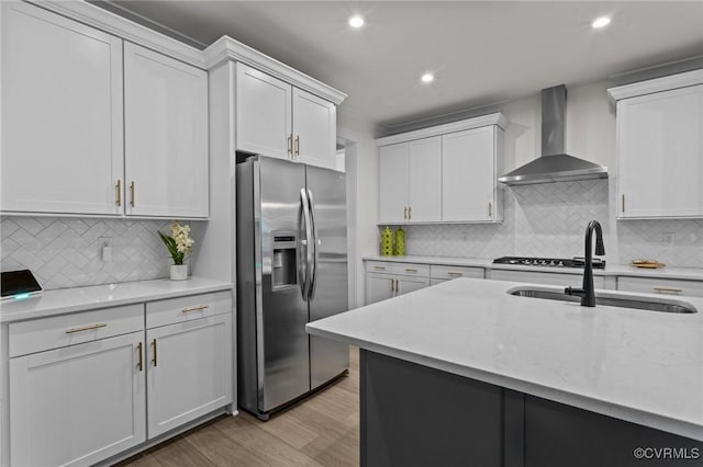 9975 Honeybee Dr, Mechanicsville, VA 23116 - kitchen with stainless steel refrigerator with ice dispenser, wall chimney exhaust hood, a sink, light wood-style flooring, and decorative backsplash
