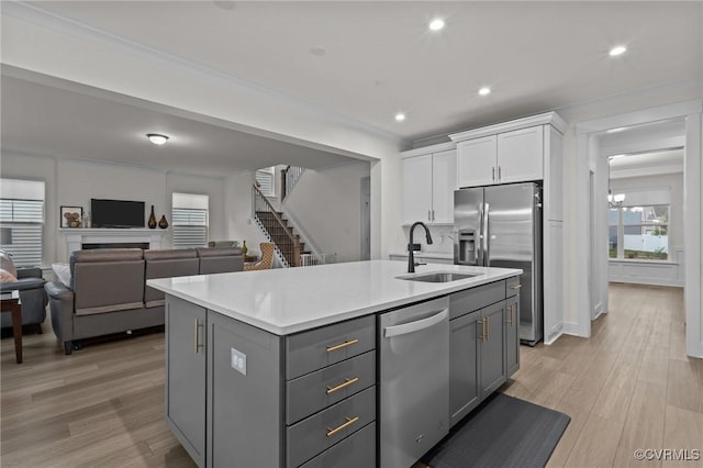 9975 Honeybee Dr, Mechanicsville, VA 23116 - kitchen featuring a sink, appliances with stainless steel finishes, gray cabinets, white cabinetry, and healthy amount of natural light