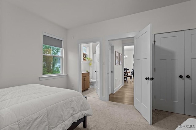 9975 Honeybee Dr, Mechanicsville, VA 23116 - bedroom with light carpet, a closet, and ensuite bath