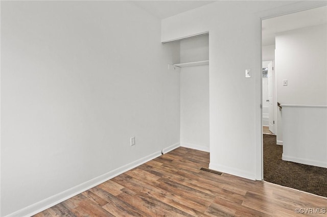 306 Cedarwood Rd, Henrico, VA 23075 - unfurnished bedroom with wood finished floors, a closet, and baseboards
