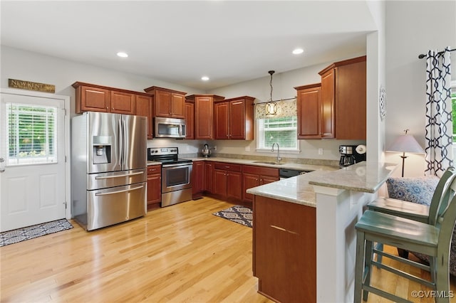 10335 Deerlake Dr, New Kent, VA 23124 - kitchen with stainless steel appliances, a sink, a peninsula, healthy amount of natural light, and recessed lighting
