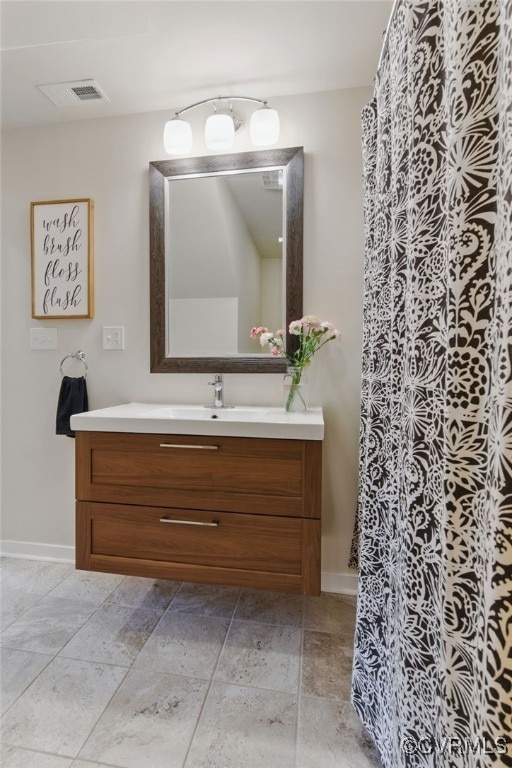 10335 Deerlake Dr, New Kent, VA 23124 - full bath with vanity, baseboards, and a shower with curtain