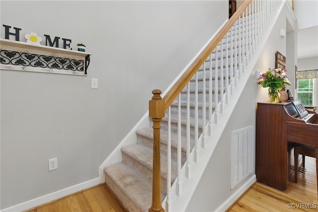 10335 Deerlake Dr, New Kent, VA 23124 - stairway with wood finished floors and baseboards