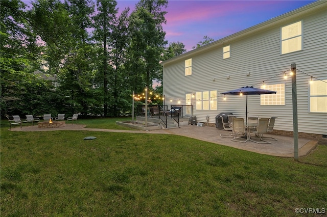 10335 Deerlake Dr, New Kent, VA 23124 - back of house featuring a patio area, an outdoor fire pit, and a yard