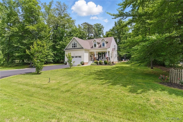 10335 Deerlake Dr, New Kent, VA 23124 - cape cod home featuring a porch, asphalt driveway, and a front yard