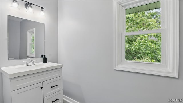 bathroom featuring vanity and baseboards