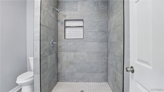 full bath with toilet and a stall shower