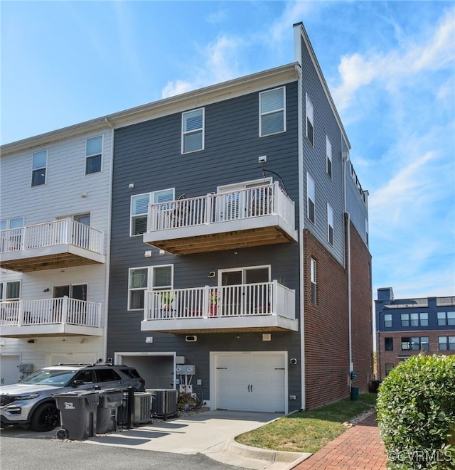 5301 Old Main St Unit A, Henrico, VA 23231 - view of property with driveway, an attached garage, and central air condition unit