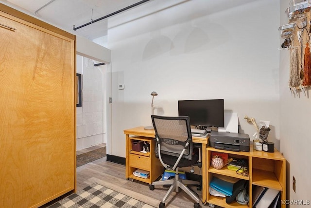 office space with light wood-style flooring