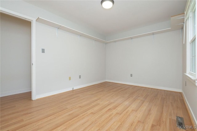 9830 Knobs Hill Ln, Amelia Courthouse, VA 23002 - empty room featuring light wood-style flooring, baseboards, and healthy amount of natural light