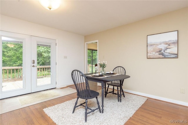 9830 Knobs Hill Ln, Amelia Courthouse, VA 23002 - dining room with french doors, wood finished floors, and baseboards