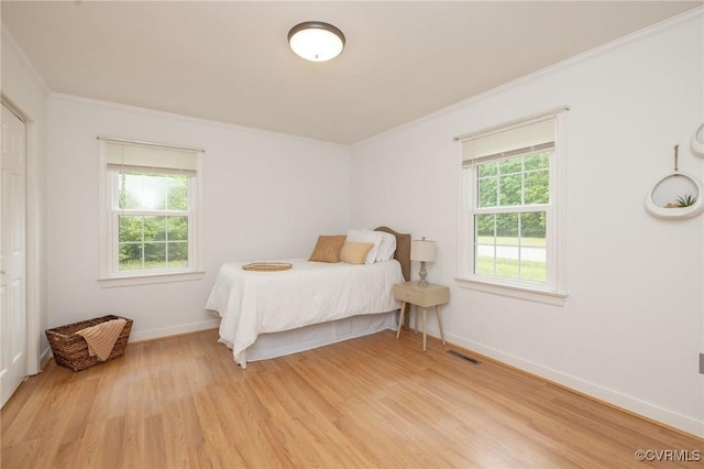 9830 Knobs Hill Ln, Amelia Courthouse, VA 23002 - bedroom with crown molding, light wood-type flooring, and baseboards